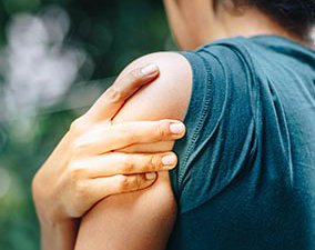 Woman with pain in shoulder and upper arm.